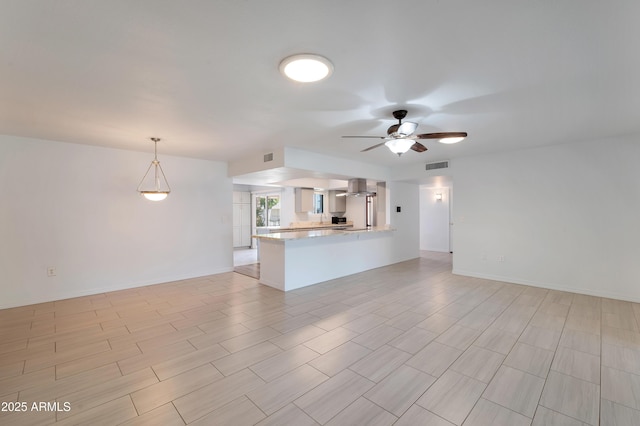 unfurnished living room featuring a ceiling fan, visible vents, and baseboards