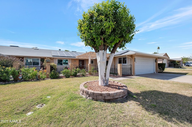 single story home with an attached garage, driveway, solar panels, and a front yard