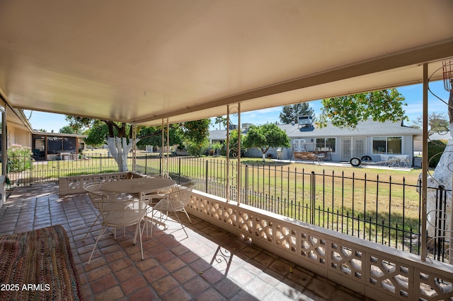 view of patio with fence and outdoor dining space