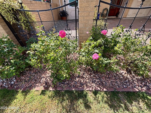 details featuring brick siding and fence