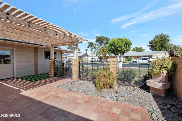 view of patio featuring a residential view, a gate, fence, and a pergola