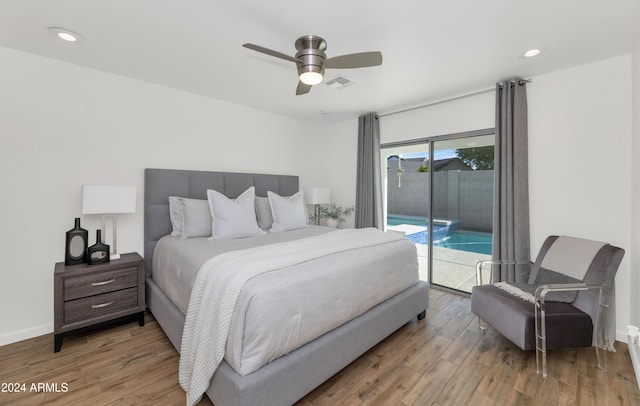 bedroom featuring access to outside, hardwood / wood-style floors, and ceiling fan