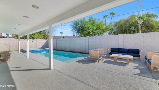 view of pool with outdoor lounge area and a patio area