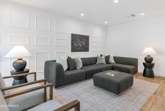 living room with light hardwood / wood-style flooring