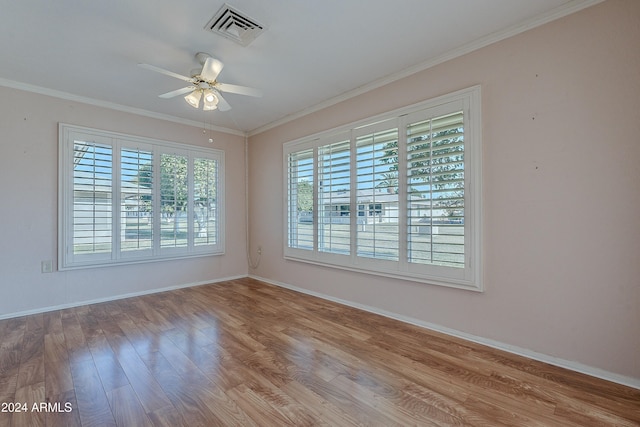 empty room with crown molding, ceiling fan, and light hardwood / wood-style floors