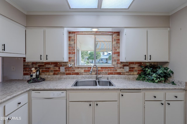 kitchen with ornamental molding, white dishwasher, sink, and white cabinets