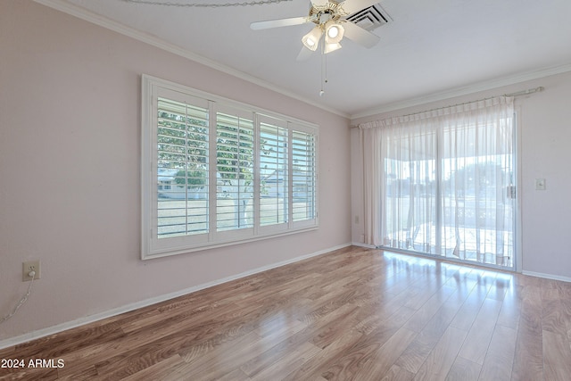 spare room featuring crown molding, ceiling fan, and light hardwood / wood-style floors