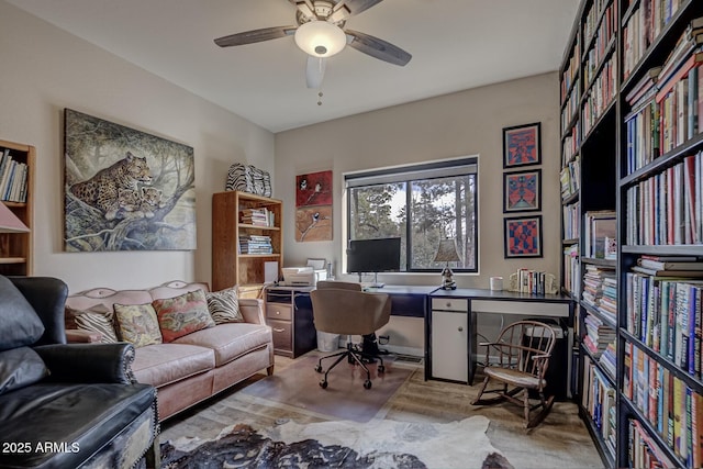 office area featuring a ceiling fan and wood finished floors