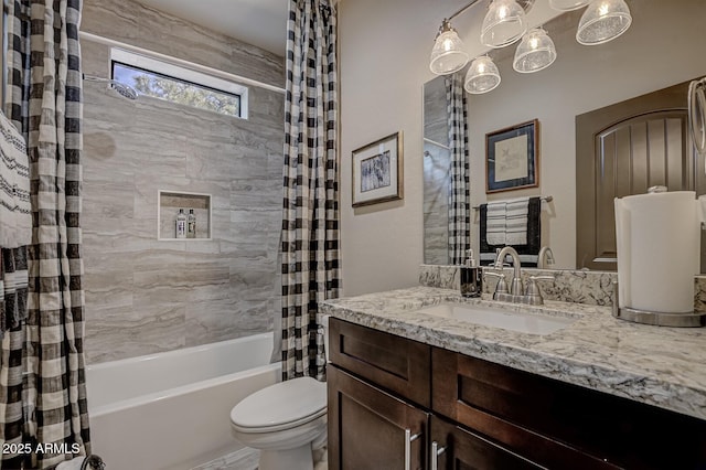 full bathroom with vanity, toilet, and shower / bath combo with shower curtain