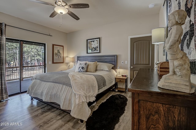 bedroom with access to exterior, ceiling fan, and wood finished floors