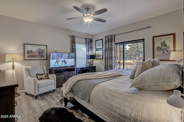 bedroom with light wood-style floors, access to outside, baseboards, and a ceiling fan