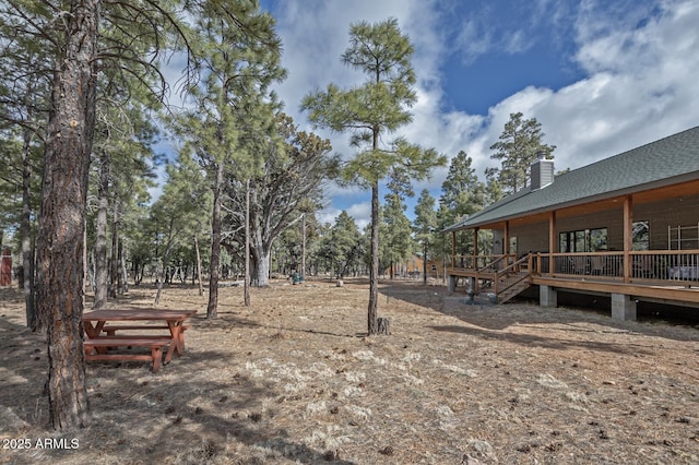 view of yard with a wooden deck