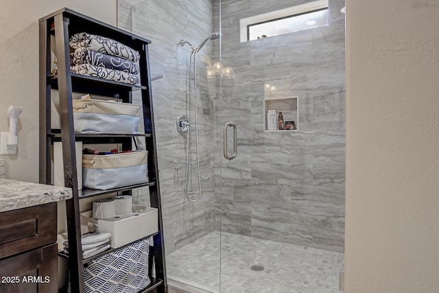 bathroom featuring a shower stall