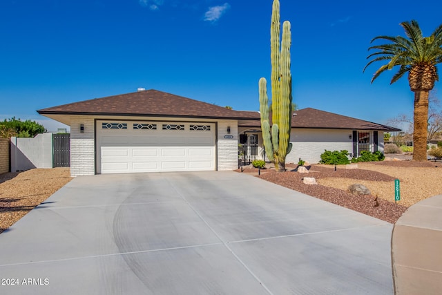 ranch-style house featuring a garage