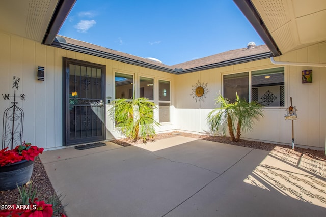 entrance to property with a patio area