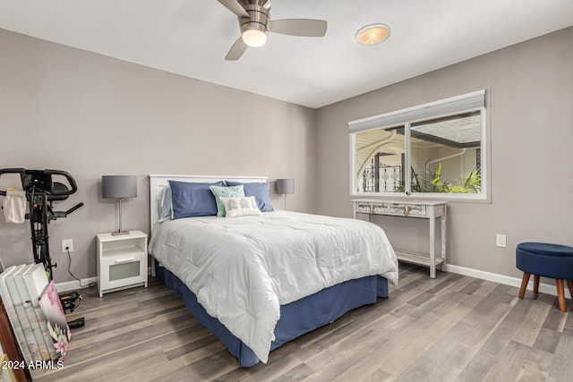 bedroom featuring ceiling fan and wood-type flooring