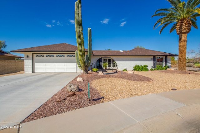 single story home with a garage