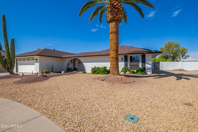 ranch-style house featuring a garage