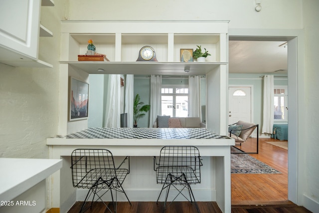 kitchen featuring dark hardwood / wood-style floors and breakfast area