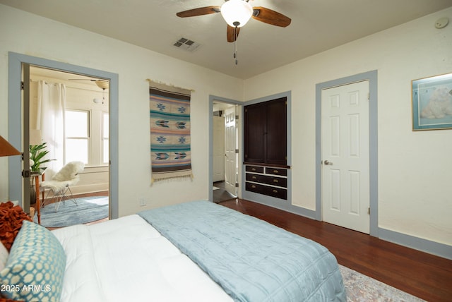 bedroom featuring dark wood-type flooring and ceiling fan