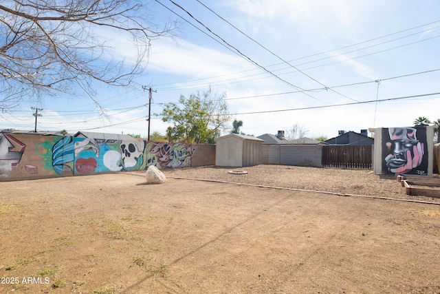 view of yard with a storage unit