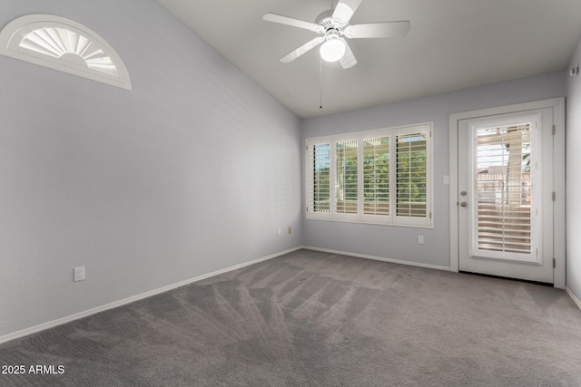 spare room with ceiling fan, lofted ceiling, and carpet floors