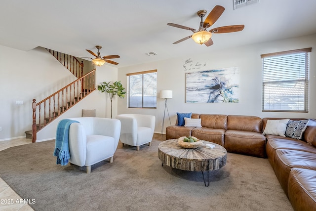 living room featuring ceiling fan and light carpet