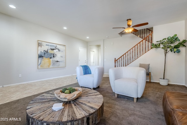 tiled living room with ceiling fan