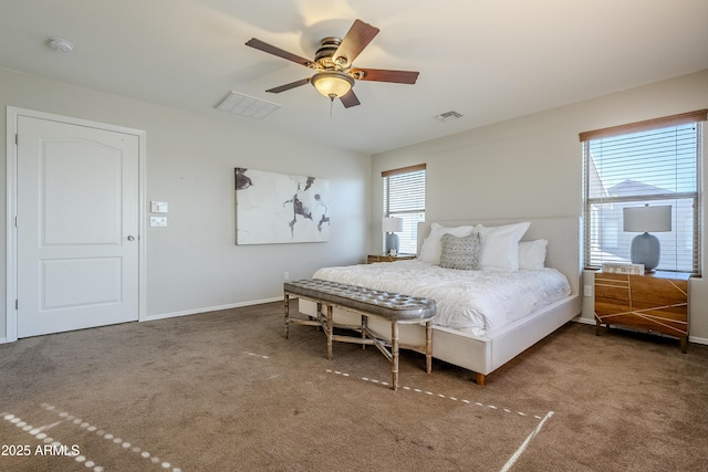 bedroom featuring ceiling fan, carpet flooring, and multiple windows