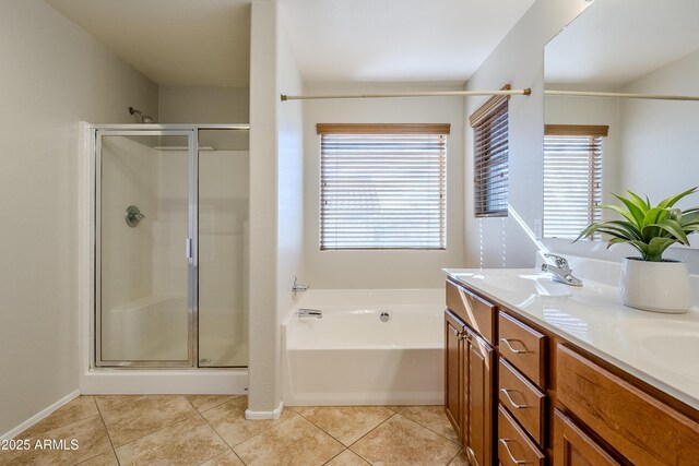 bathroom with tile patterned flooring, vanity, and shower with separate bathtub