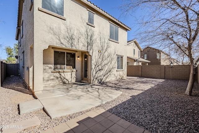 back of house featuring a patio