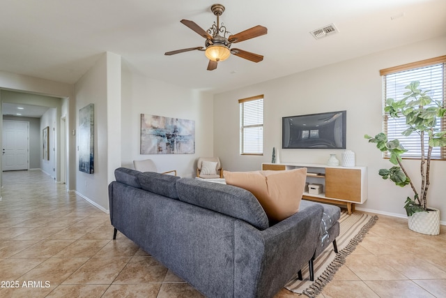 living room featuring ceiling fan and light tile patterned floors