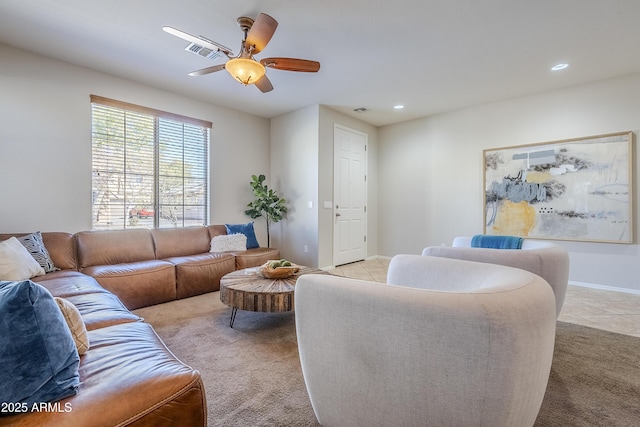 carpeted living room featuring ceiling fan