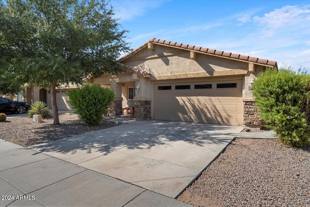 view of front of home with a garage