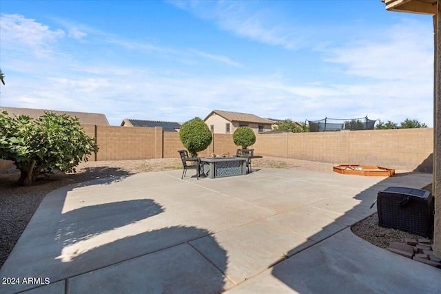 view of patio featuring a fire pit