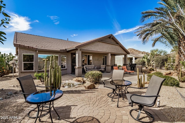 back of house with a patio area