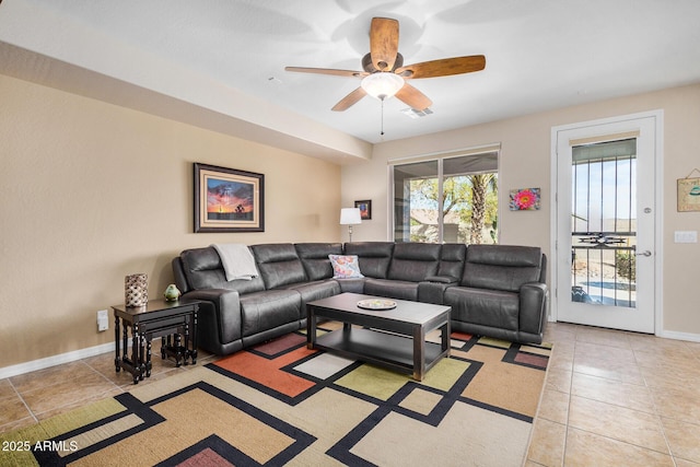 tiled living room featuring ceiling fan