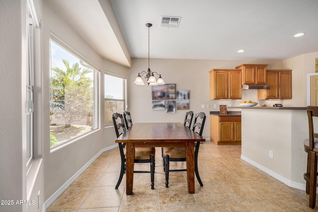 dining space featuring a chandelier and light tile patterned floors