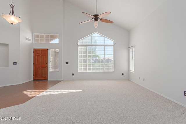 4356 E Rancho Tierra Dr, Cave Creek, AZ 85331 - foyer entrance with carpet flooring, a ceiling fan, high vaulted ceiling, and baseboards