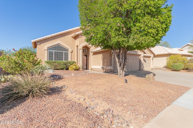 4356 E Rancho Tierra Dr, Cave Creek, AZ 85331 - view of front of property with concrete driveway, stucco siding, and a garage