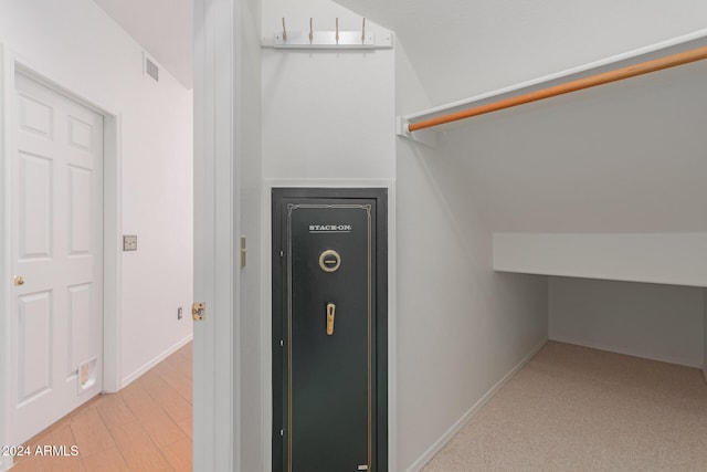 interior space featuring vaulted ceiling and light hardwood / wood-style floors