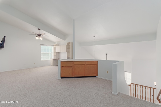 carpeted empty room featuring vaulted ceiling with beams and ceiling fan