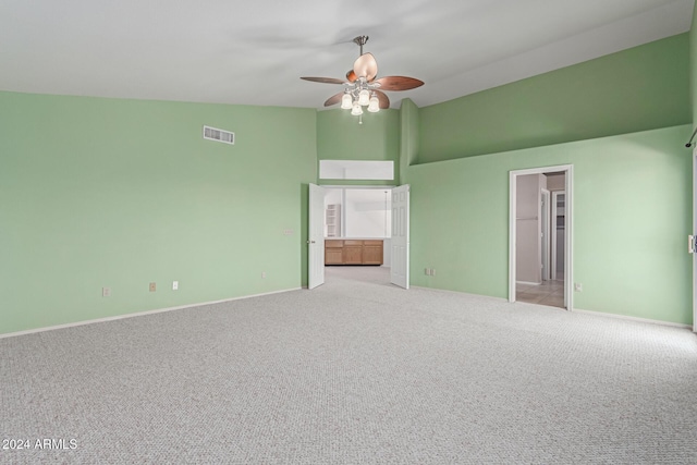 4356 E Rancho Tierra Dr, Cave Creek, AZ 85331 - unfurnished bedroom with high vaulted ceiling, carpet floors, baseboards, a ceiling fan, and ensuite bathroom