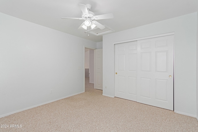 unfurnished bedroom featuring a closet, ceiling fan, and light carpet