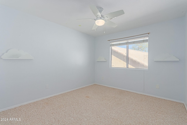 empty room with ceiling fan and carpet floors