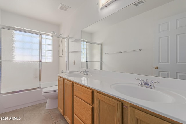 4356 E Rancho Tierra Dr, Cave Creek, AZ 85331 - full bath featuring tile patterned floors, toilet, double vanity, and shower / bath combination with glass door