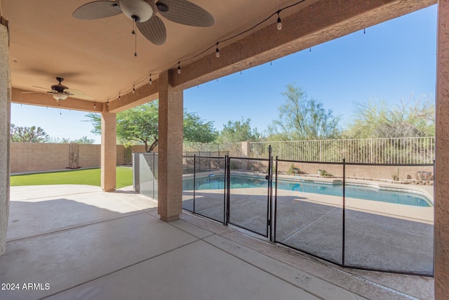 view of pool with a patio and ceiling fan