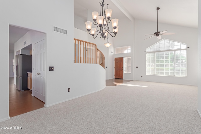 interior space with carpet floors, high vaulted ceiling, and ceiling fan with notable chandelier