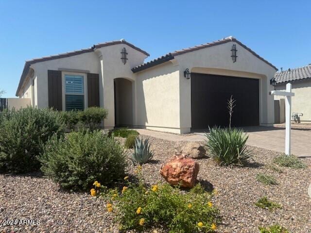 view of front of property with a garage