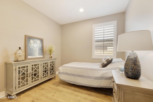 bedroom with light hardwood / wood-style flooring